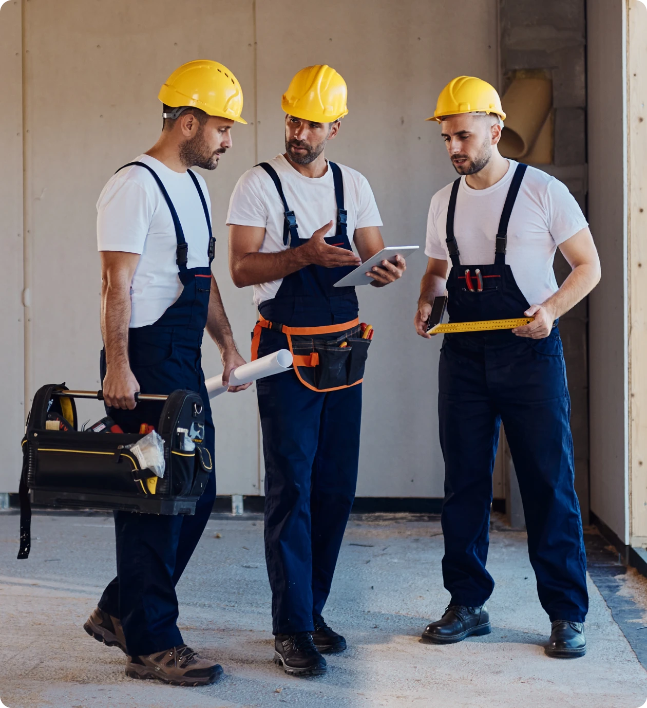 Construction workers discussing building plans