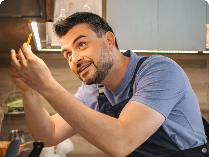 Person repairing kitchen light fixture