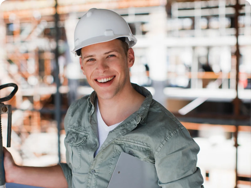 Young man in safety gear at construction